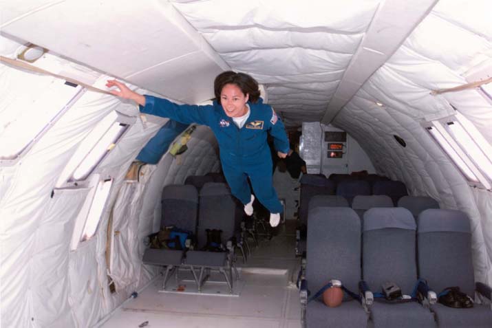 Patty along her 1998 class "The Penguins", having fun experiencing 0 gravity in the KC135, affectionately called the "vomit comet".